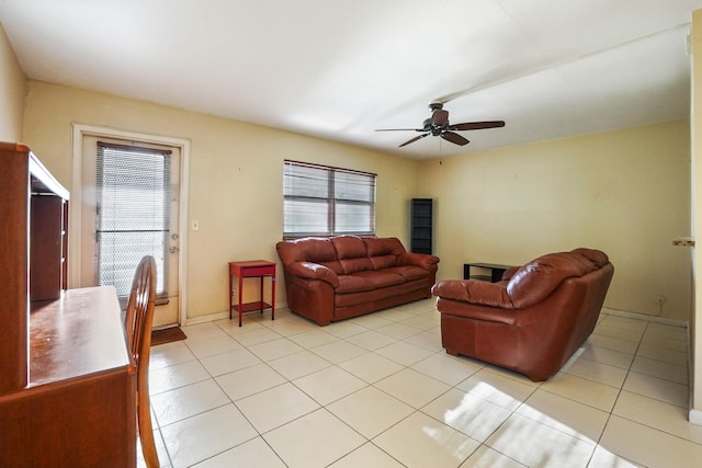 tiled living room with ceiling fan and plenty of natural light