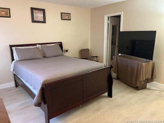 bedroom with light wood-type flooring