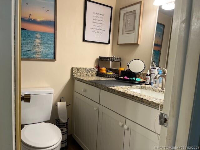 bathroom with vanity and toilet