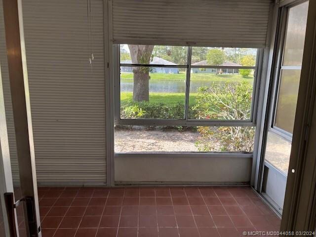 unfurnished sunroom with a healthy amount of sunlight