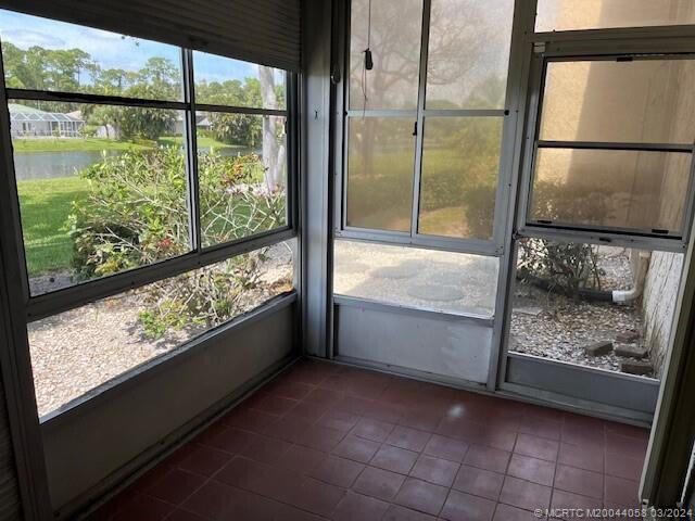 unfurnished sunroom with plenty of natural light