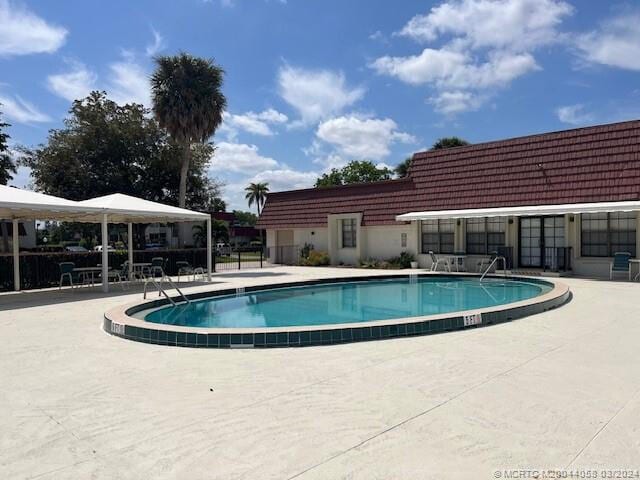 view of swimming pool featuring a patio area