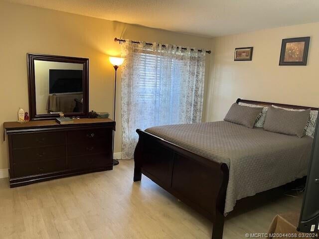 bedroom with light hardwood / wood-style flooring