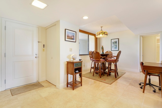 dining space featuring tile patterned flooring