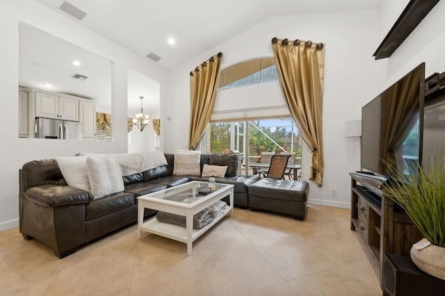 tiled living room with a chandelier and lofted ceiling