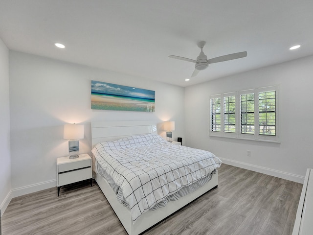 bedroom featuring light wood-type flooring and ceiling fan