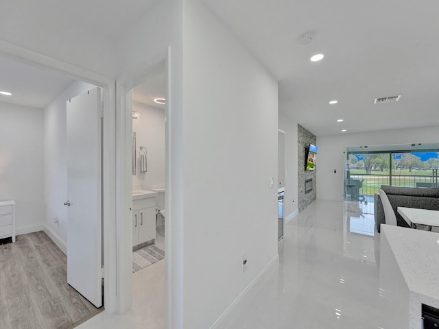 hallway featuring light wood-type flooring