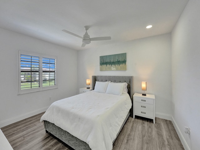 bedroom with light wood-type flooring and ceiling fan