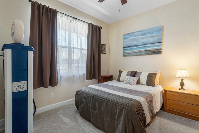 bedroom with light carpet and ceiling fan