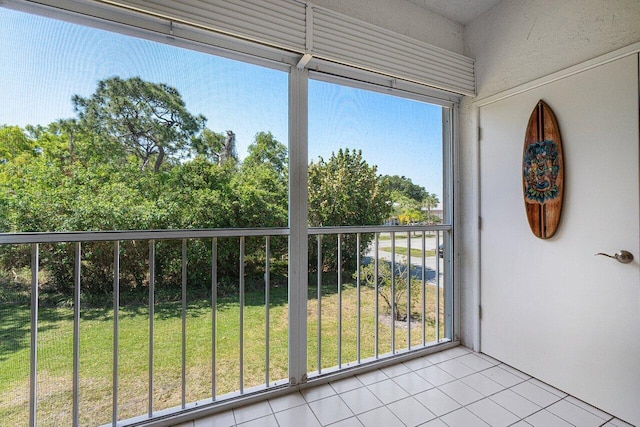 exterior space featuring a wealth of natural light and light tile patterned flooring