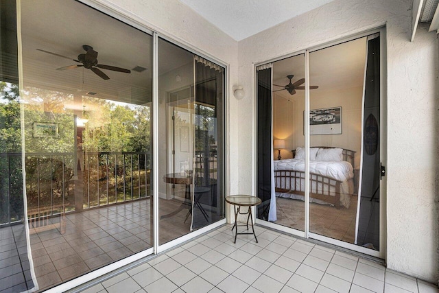 exterior space featuring ceiling fan and tile patterned floors