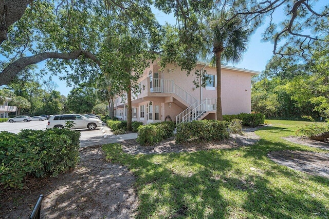 view of front of home with a front yard