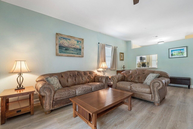 living room with light hardwood / wood-style flooring