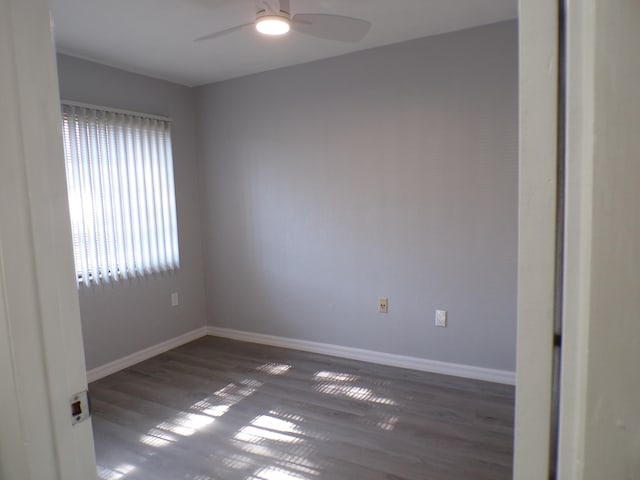 empty room with hardwood / wood-style flooring and ceiling fan