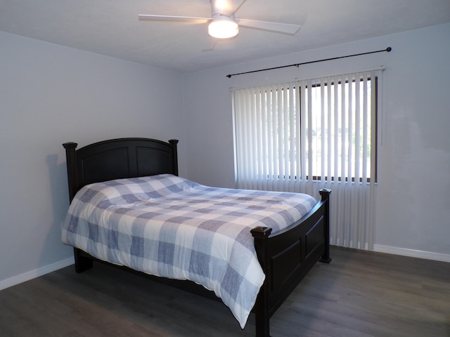 bedroom featuring ceiling fan and dark hardwood / wood-style flooring