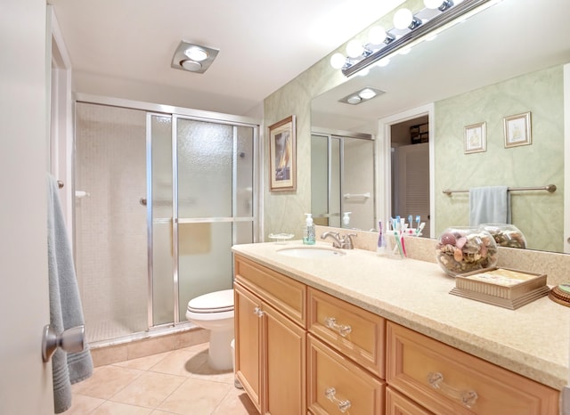 bathroom featuring vanity, tile patterned flooring, an enclosed shower, and toilet