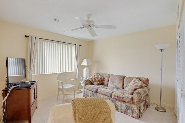 tiled living room with ceiling fan