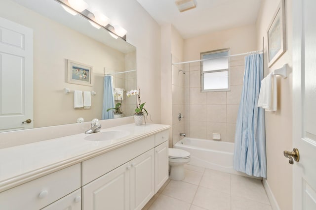 full bathroom with shower / bath combo with shower curtain, toilet, tile floors, and vanity