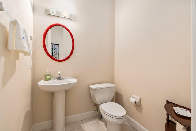 bathroom featuring toilet and tile flooring