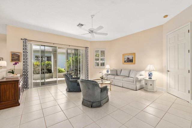 tiled living room with ceiling fan