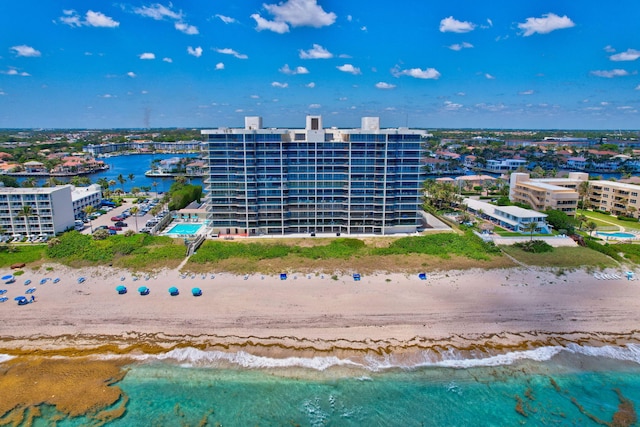 drone / aerial view with a beach view and a water view