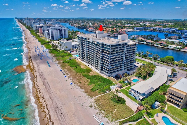 bird's eye view with a beach view and a water view