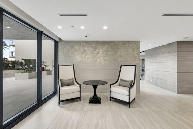 living area with light tile flooring