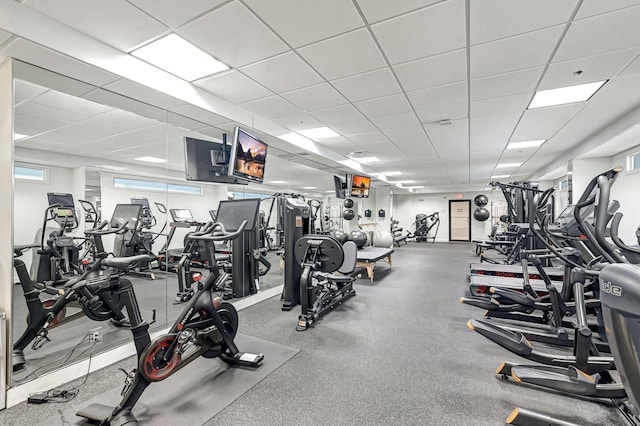 workout area with a paneled ceiling