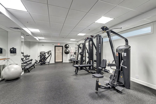 exercise room with a drop ceiling