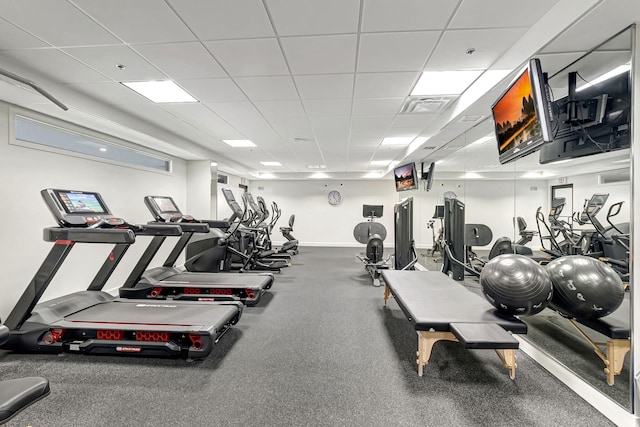 gym featuring a paneled ceiling