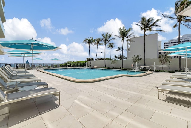 view of swimming pool featuring a patio area