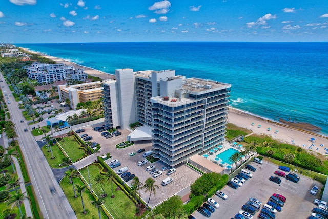 bird's eye view featuring a beach view and a water view