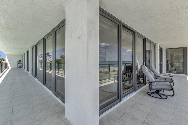 view of patio featuring a balcony