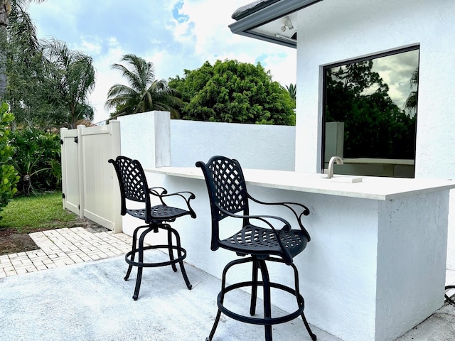 view of patio / terrace featuring a wet bar