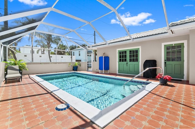 view of pool featuring a lanai and a patio