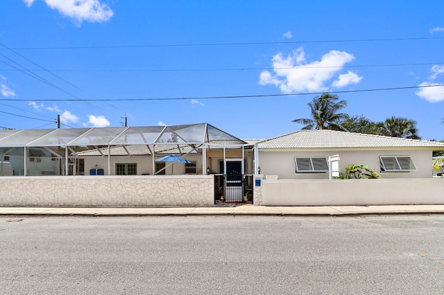 view of front of home with glass enclosure