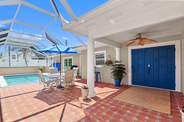 view of patio / terrace with glass enclosure and ceiling fan