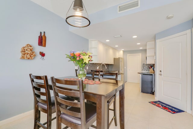 dining room with light tile floors