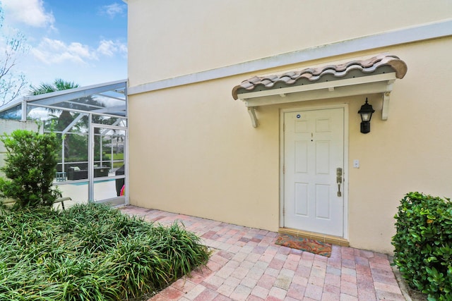 entrance to property featuring a patio area