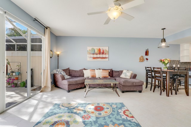 living room with ceiling fan and light tile floors