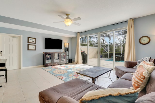 living room featuring ceiling fan and light tile floors