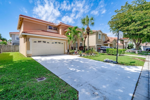 mediterranean / spanish house with a garage and a front lawn