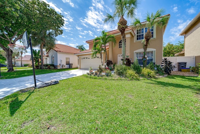 mediterranean / spanish-style home featuring a front lawn and a garage