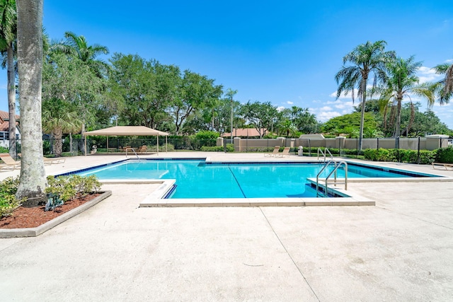 view of swimming pool featuring a patio area