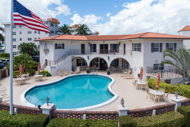 view of pool featuring a patio