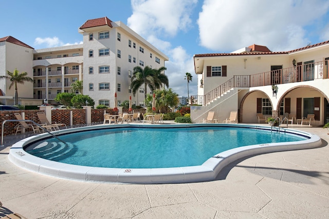 view of swimming pool featuring a patio area