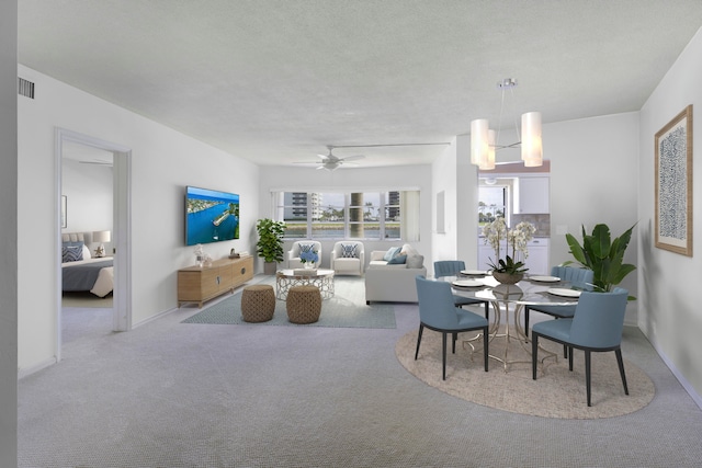 carpeted living room featuring ceiling fan with notable chandelier and a textured ceiling