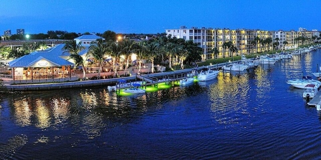 property view of water with a boat dock and a gazebo