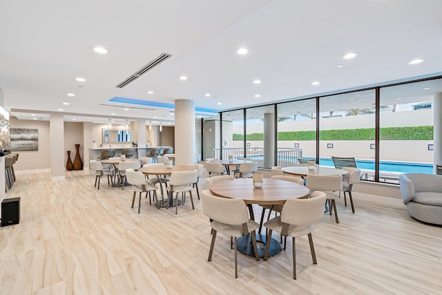 dining space featuring light hardwood / wood-style floors