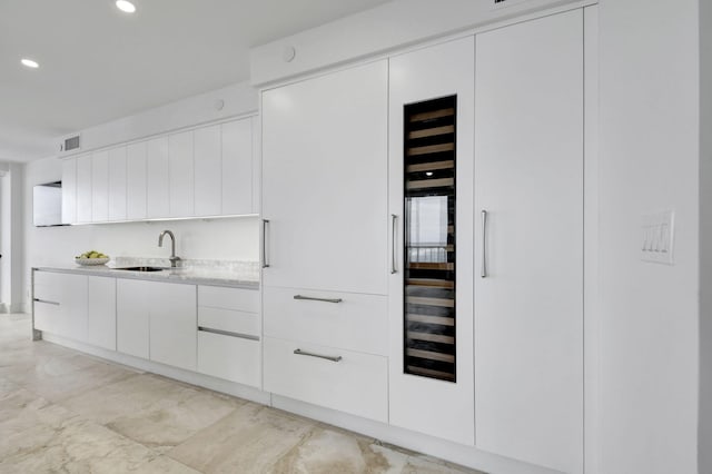 kitchen with white cabinets and sink